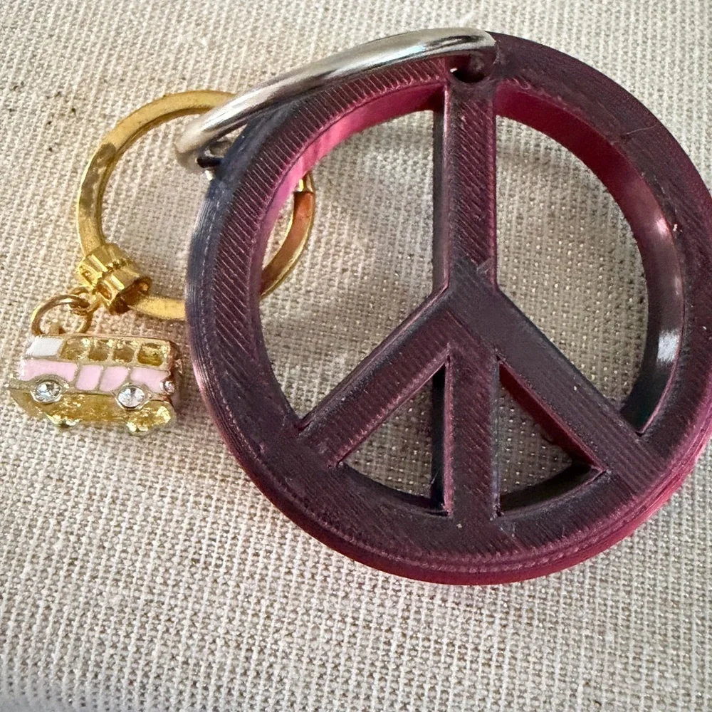 Gold Ring Keychain with Pink Bus Charm also peace sign keychain